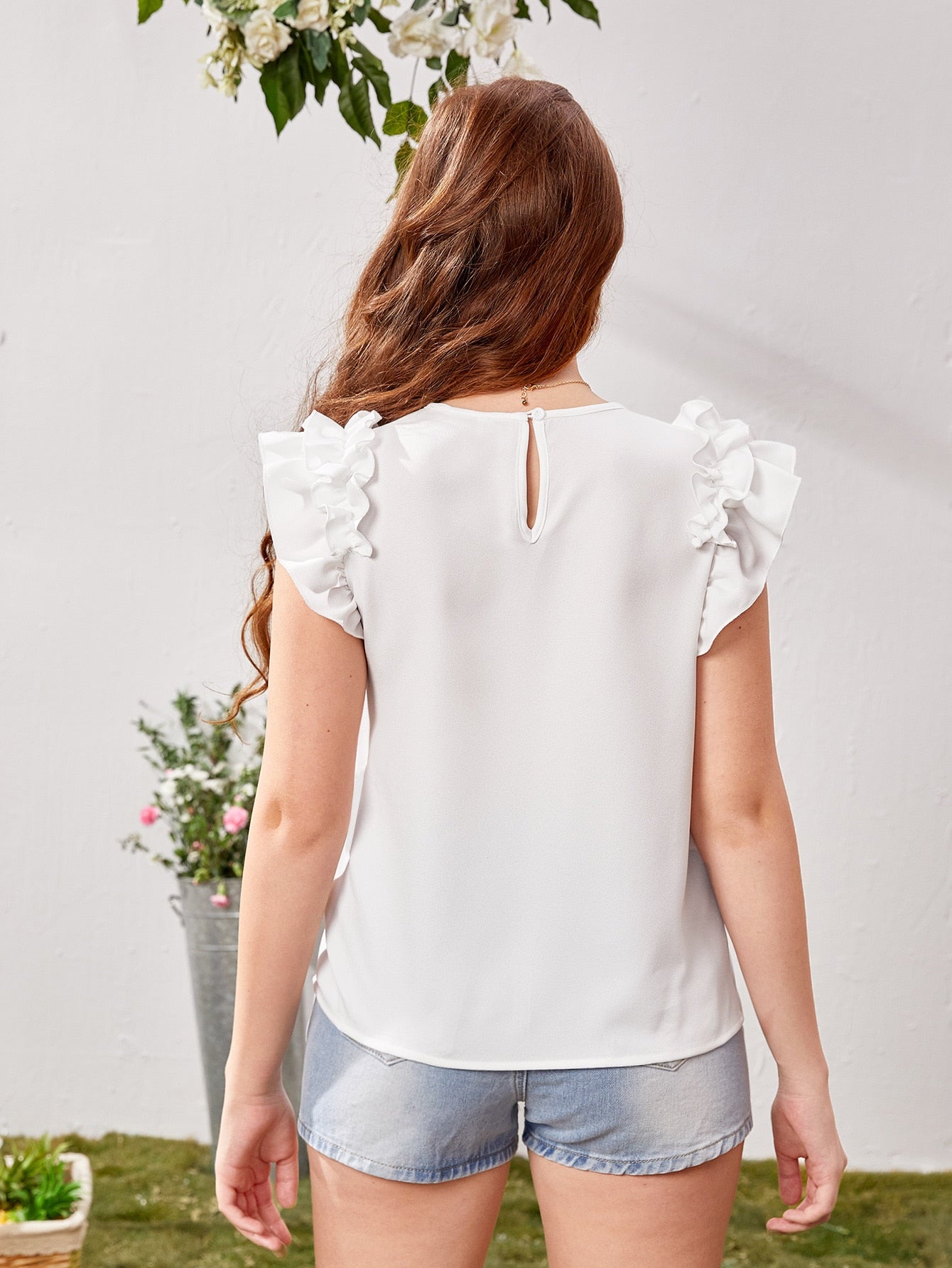 Blusa con mangas con volantes