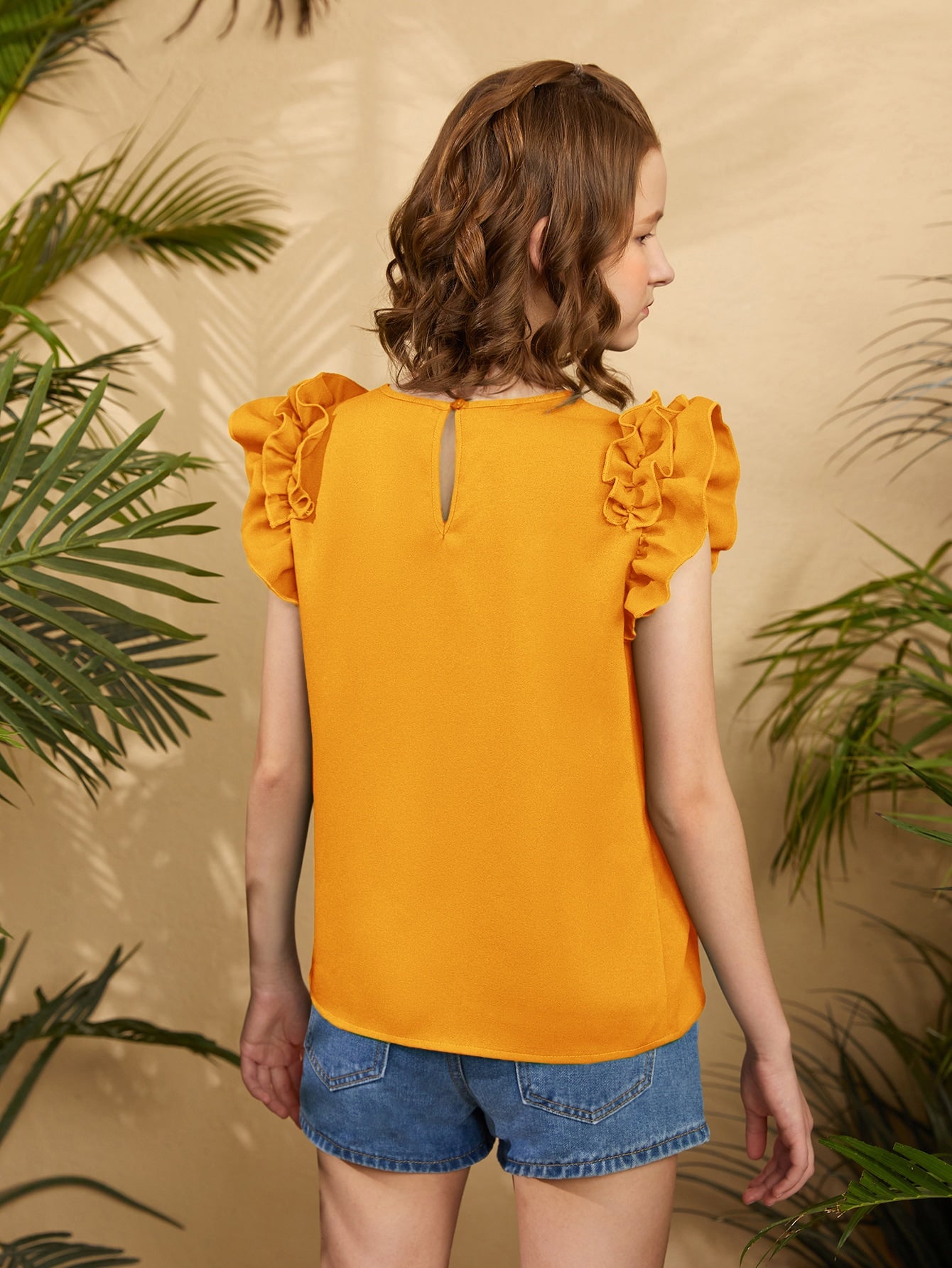 Blusa con mangas con volantes